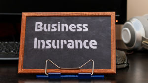 Business Insurance Services Concept. The Text Is Written On A Ch